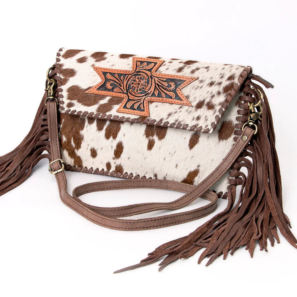 American Darling small crossbody messenger bag with cowhide leather, fringes, and adjustable strap.
