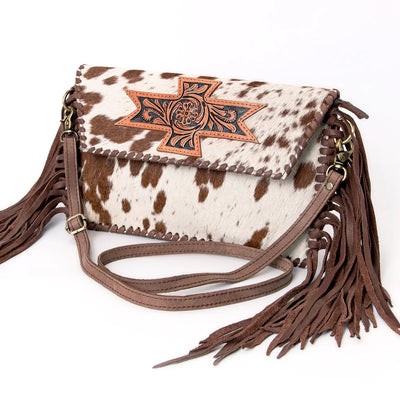 American Darling small crossbody messenger bag with fringes and carved leather design.