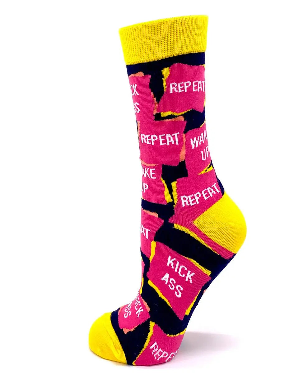 Women's colorful crew socks with "Wake Up Kick Ass Repeat" text, stylish and comfortable fit for shoe sizes 5-10.