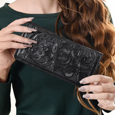 Black American Darling Wallet ADBG1269A with hand-tooled floral design in genuine full grain leather held by woman