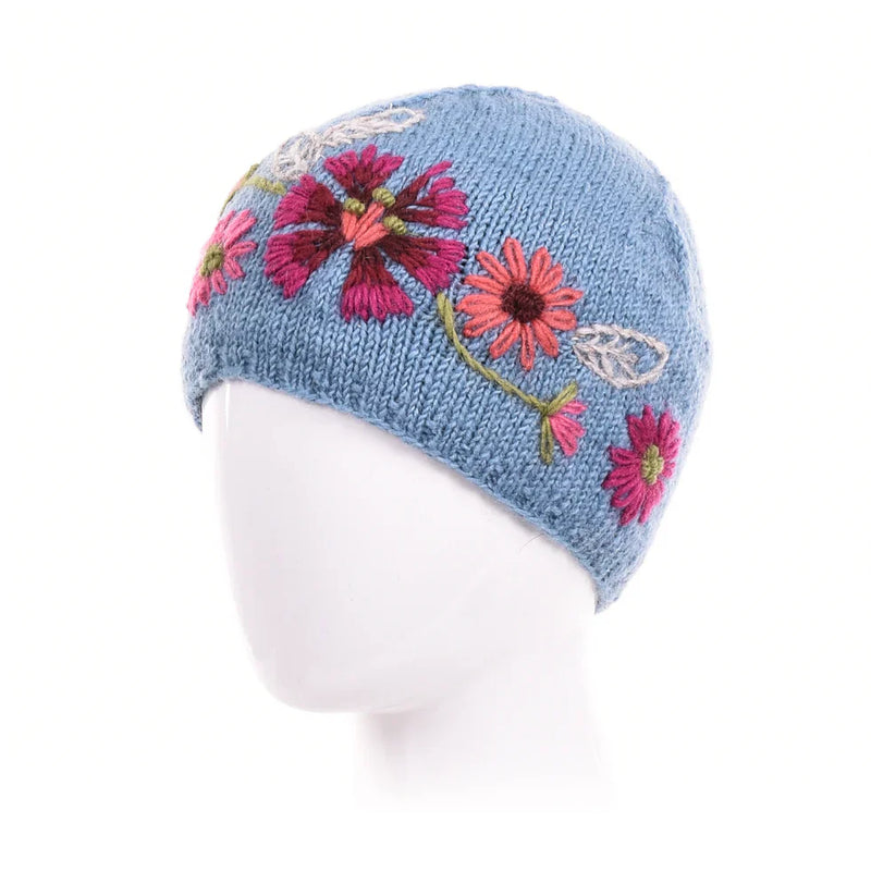 Light blue Stella Wool Beanie with hand-embroidered pink and red floral designs on soft knitted wool.