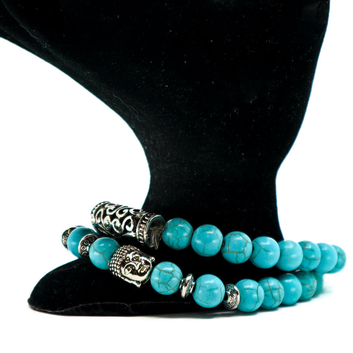 Turquoise Bracelet Set with vibrant turquoise beads and silver decorative accents on black display stand