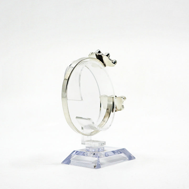 Handmade sterling silver cuff bracelet with turquoise stones on display stand