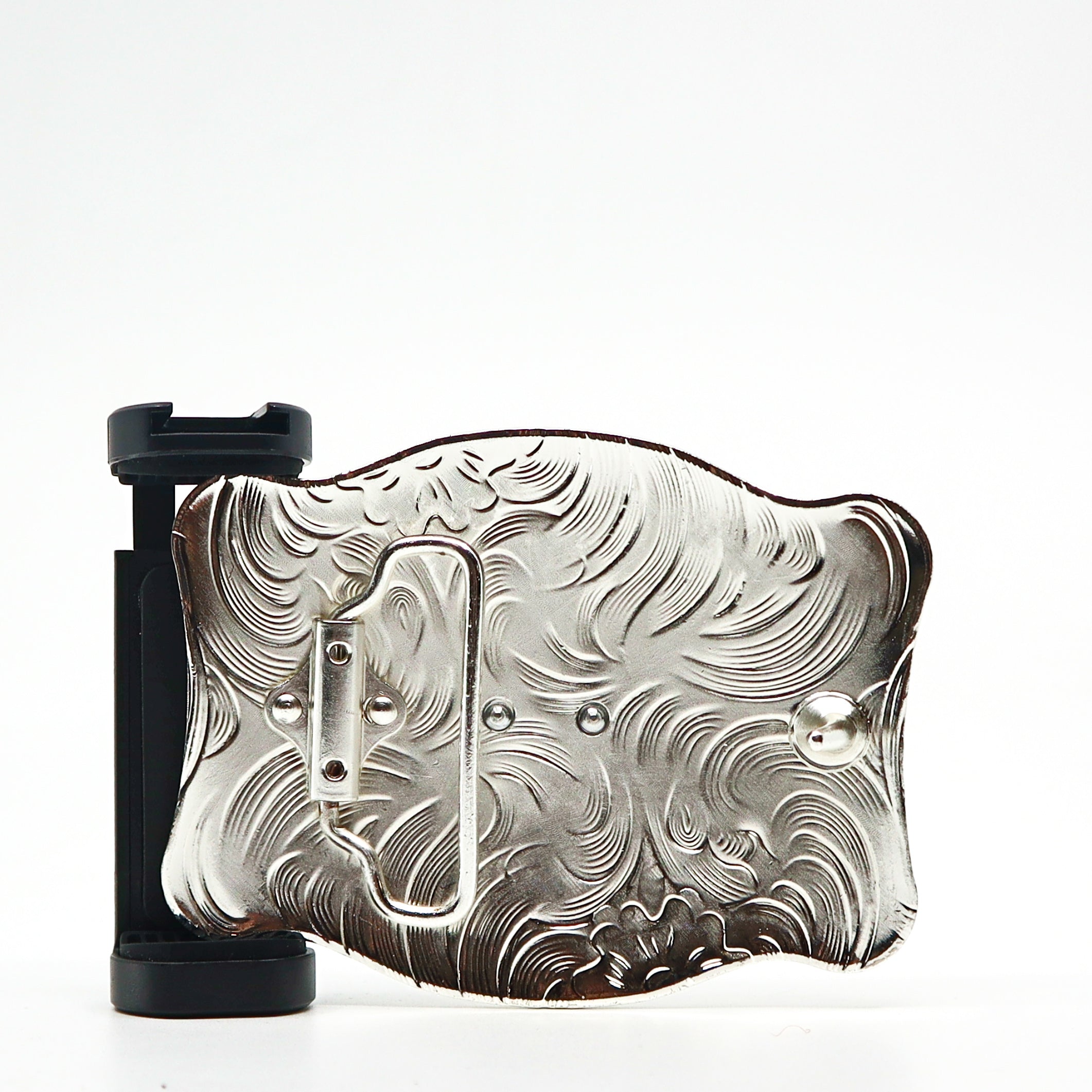 Ornate silver belt buckle PSTPBB00 with intricate swirling patterns and black attachment mechanism