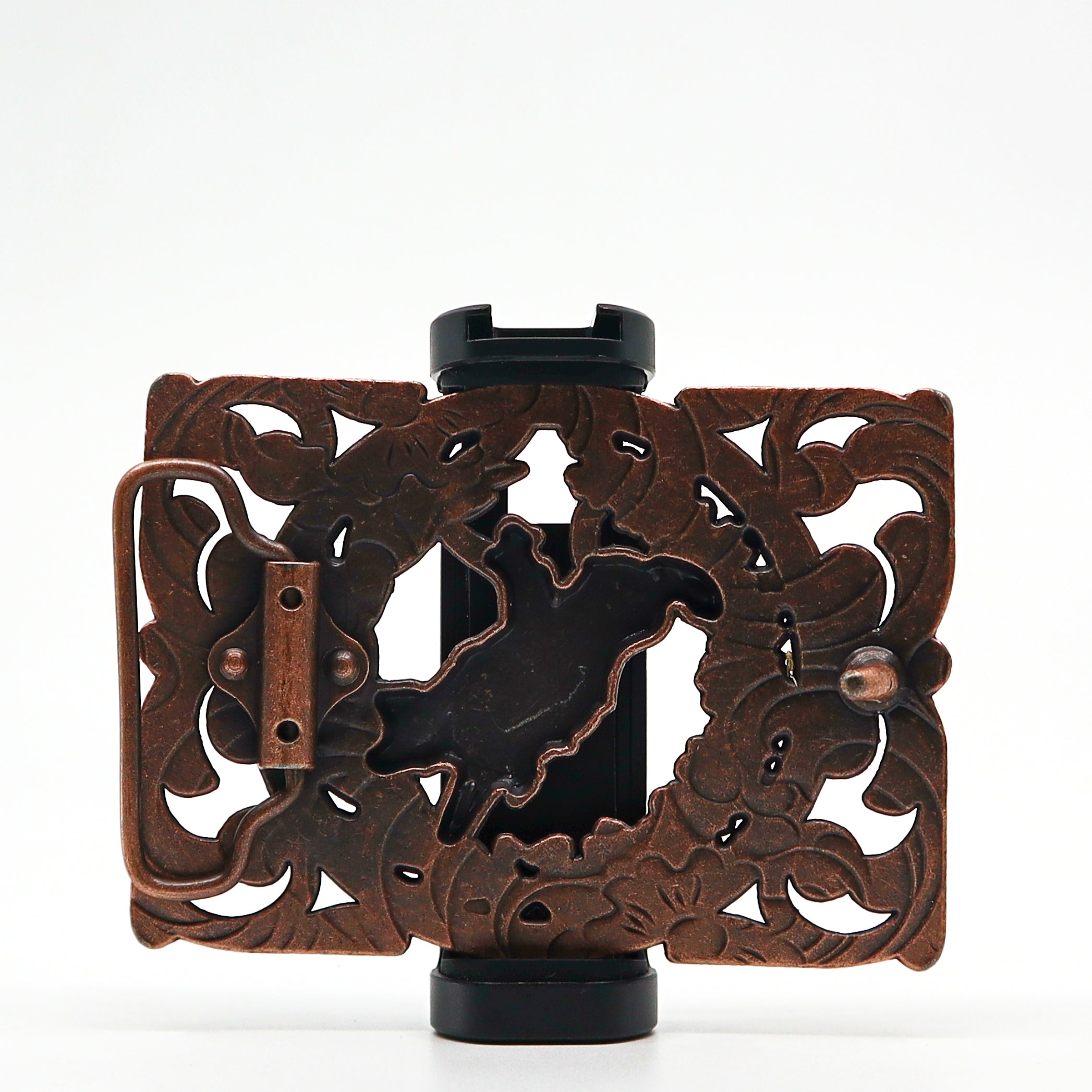 Intricately designed bronze belt buckle with floral and animal cutout patterns