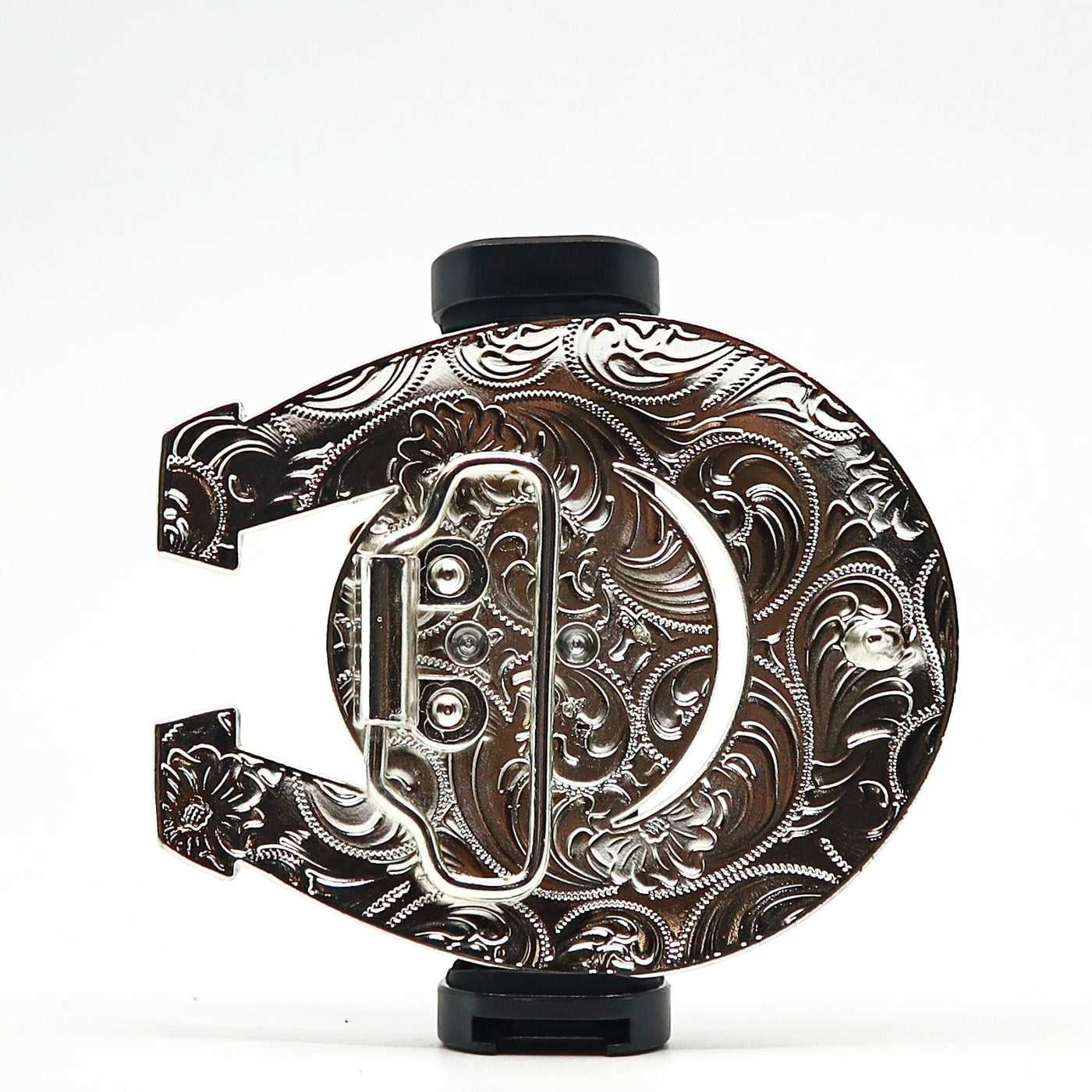 Ornate silver belt buckle with intricate engraved floral patterns