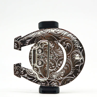 Ornate silver belt buckle with intricate engraved floral patterns