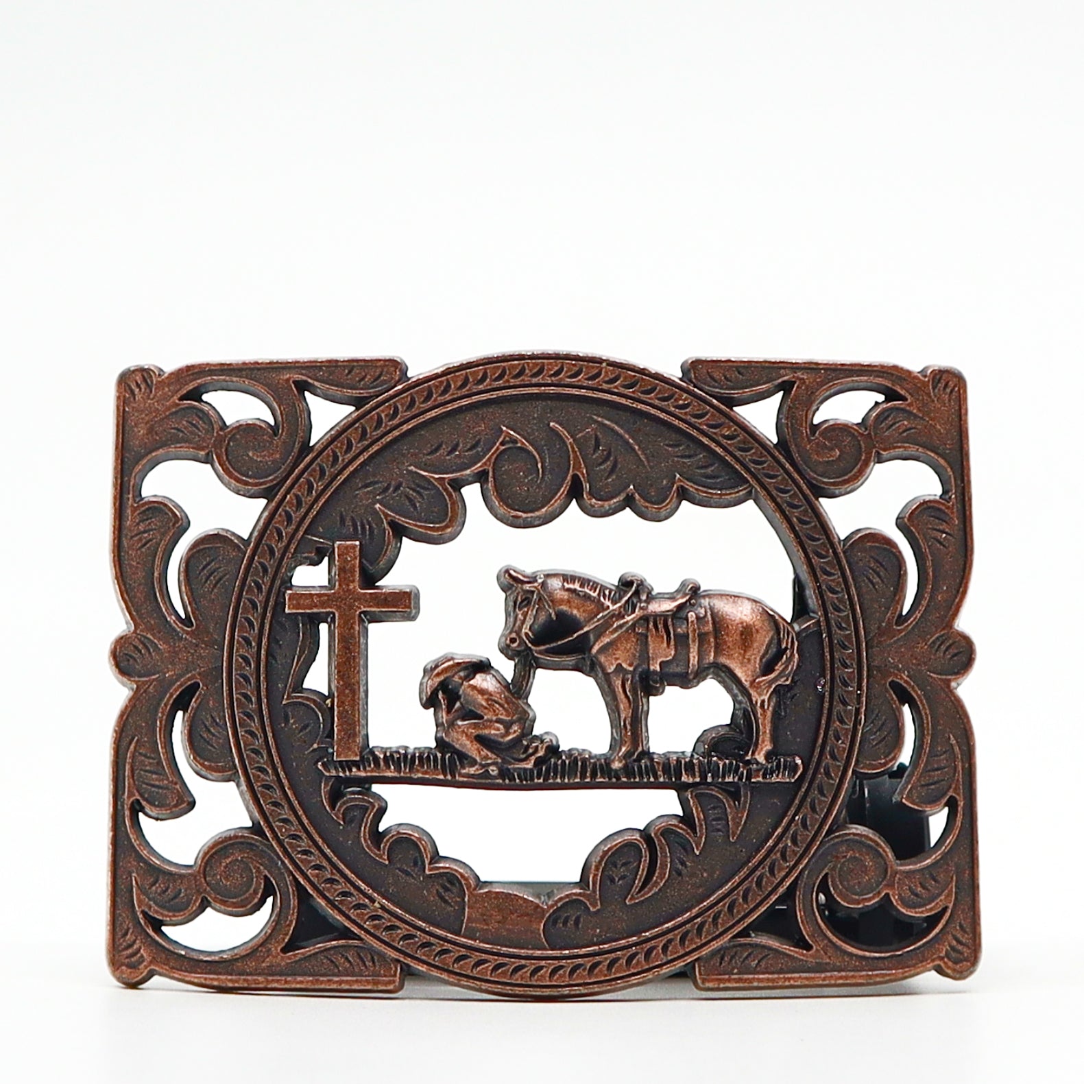 Vintage style belt buckle with cowboy, horse, and cross design in bronze finish
