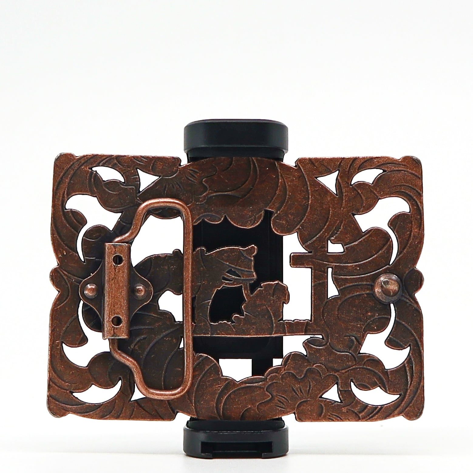 Intricately designed vintage metal belt buckle with floral and animal motifs