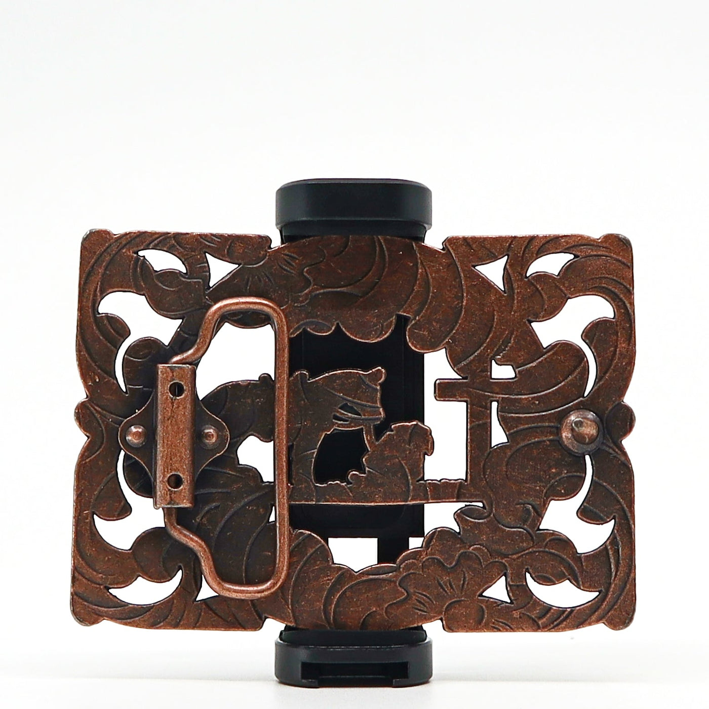 Intricately designed vintage metal belt buckle with floral and animal motifs