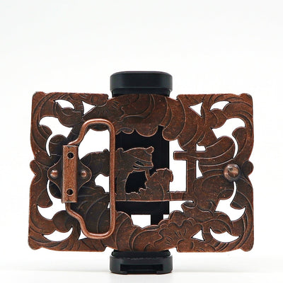 Intricately designed vintage metal belt buckle with floral and animal motifs