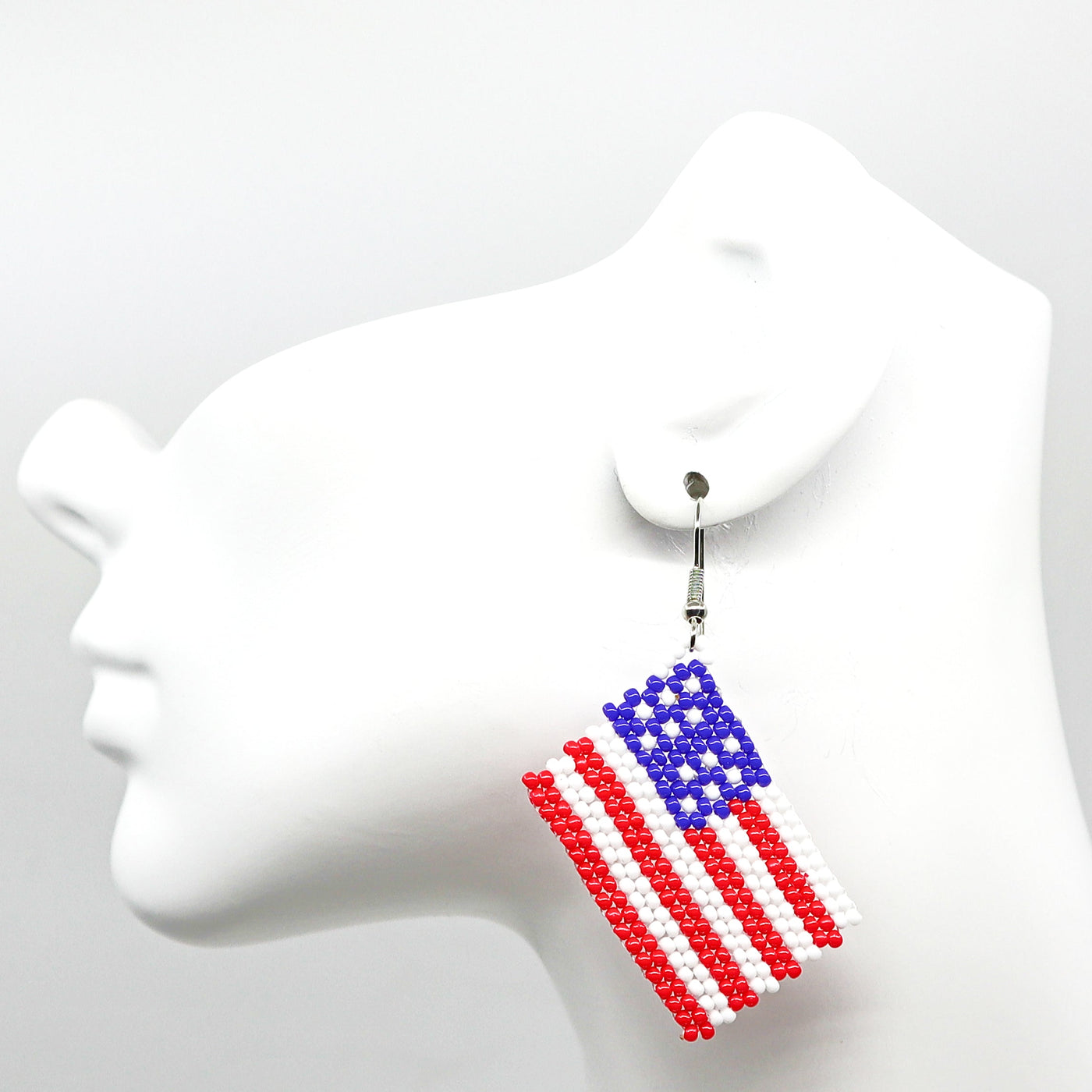 Boho USA flag-inspired handwoven beaded tassel earrings in red, white, and blue colors.