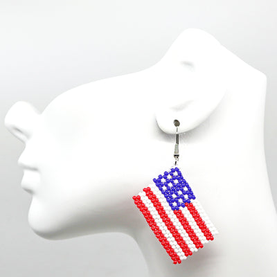 Boho USA flag-inspired handwoven beaded tassel earrings in red, white, and blue colors.