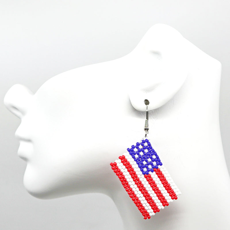 Boho USA flag-inspired handwoven beaded tassel earrings in red, white, and blue colors.