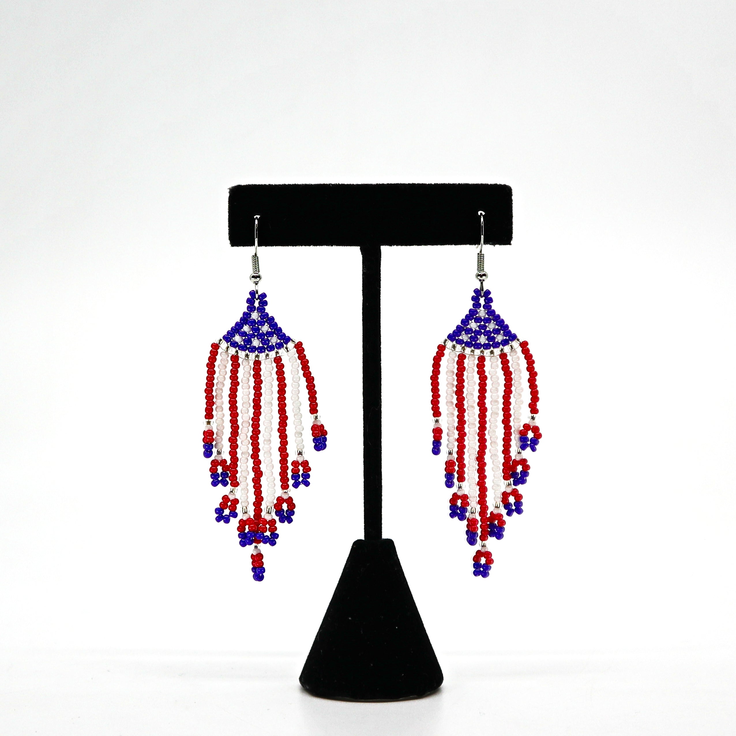Boho USA flag inspired beaded tassel earrings with red, white, and blue handwoven rice beads and lightweight design.