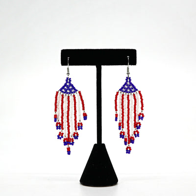 Boho USA flag inspired beaded tassel earrings with red, white, and blue handwoven rice beads and lightweight design.