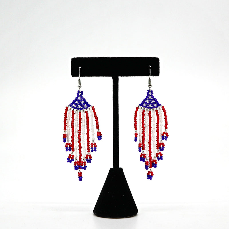 Boho USA flag inspired beaded tassel earrings with red, white, and blue handwoven rice beads and lightweight design.