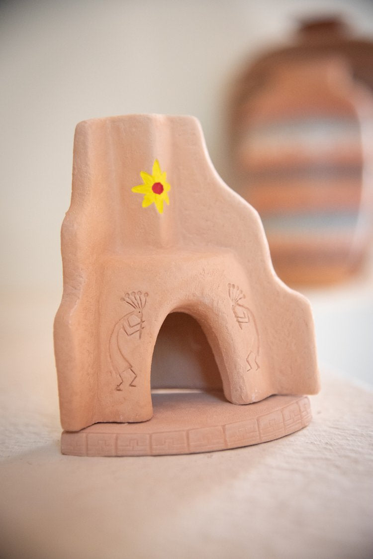 Handcrafted Southwest-style piñon incense mini fireplace with adobe design and traditional motifs
