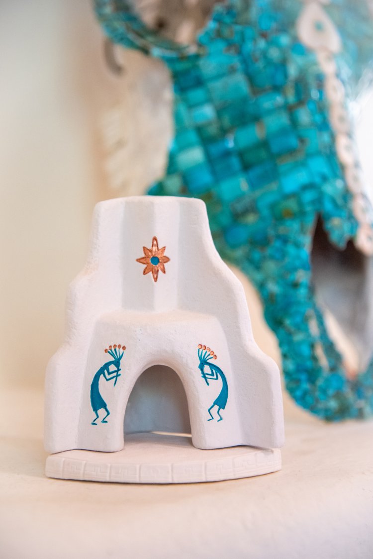 Mini Southwest-style piñon incense fireplace with adobe design and turquoise Kokopelli motifs