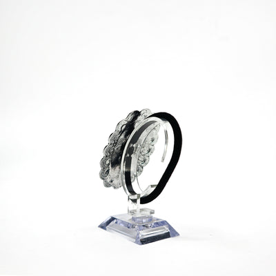 Turquoise concho ponytail holder PSTPHC07 with silver detailing on display stand