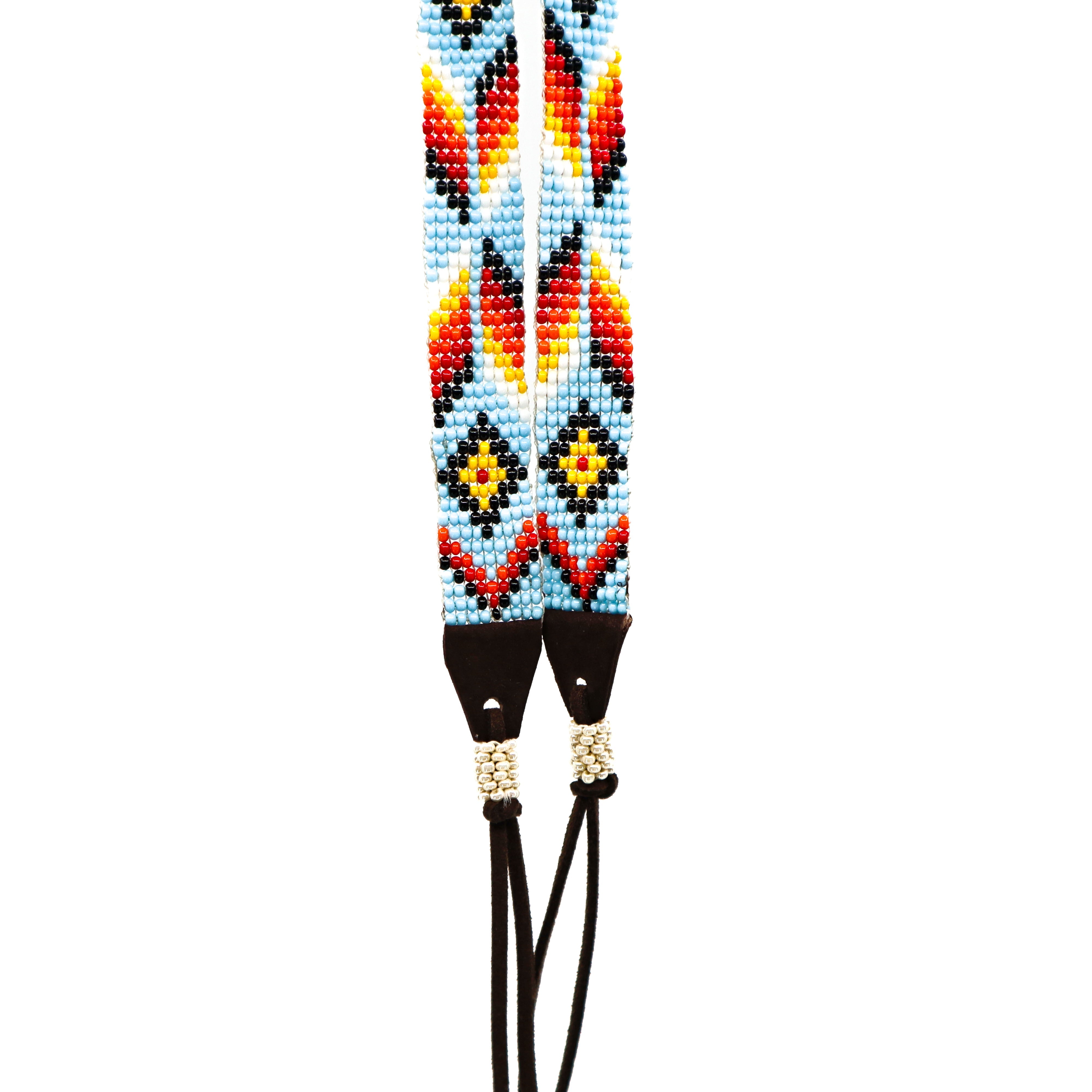 Hand-beaded hat band with colorful geometric patterns and leather ends for cowboy hats and fedoras.