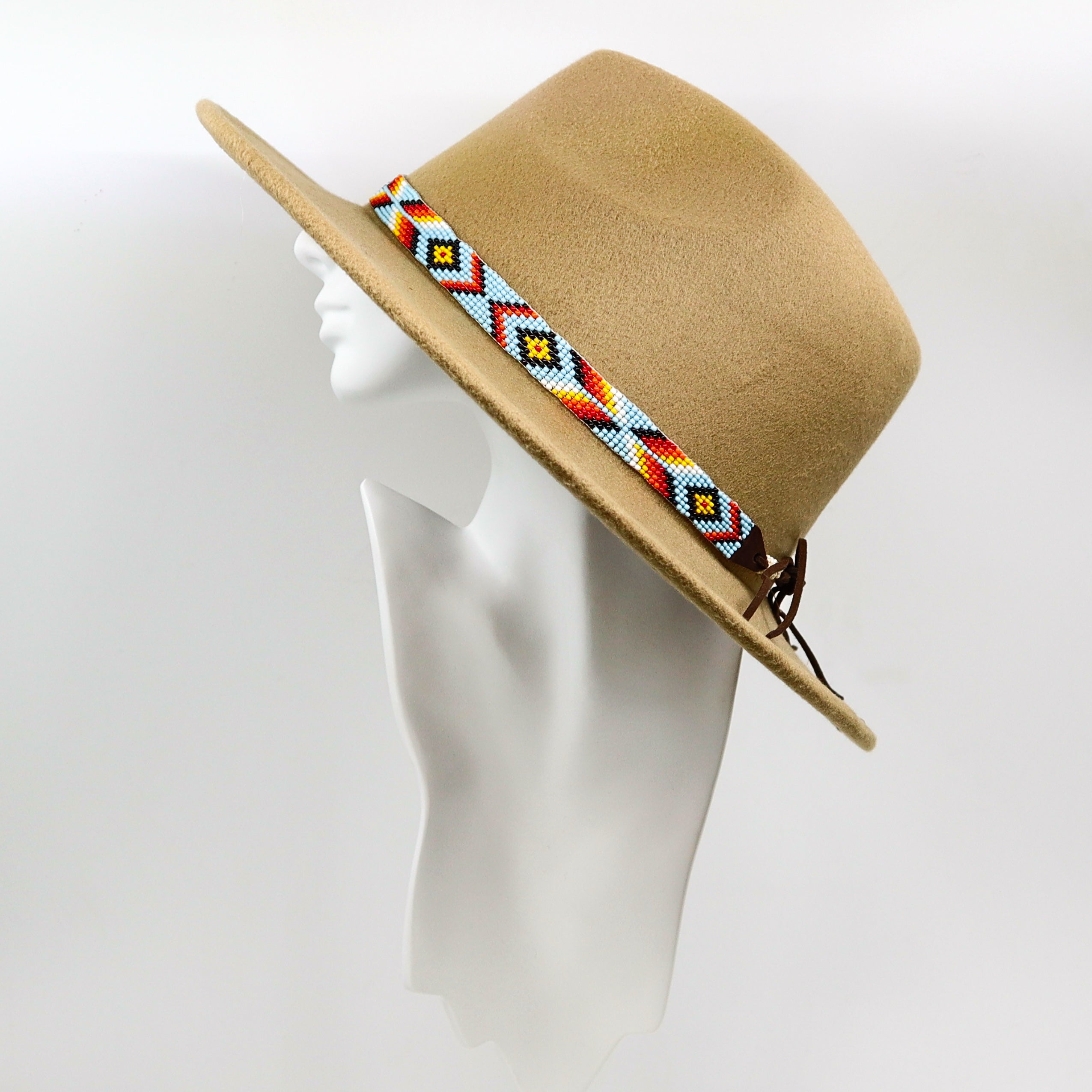 Handmade colorful hand-beaded hat band on tan felt wide-brimmed hat displayed on white mannequin