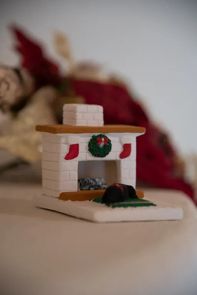 Holiday Country Hearth Puppy incense burner with festive wreath and stockings decoration