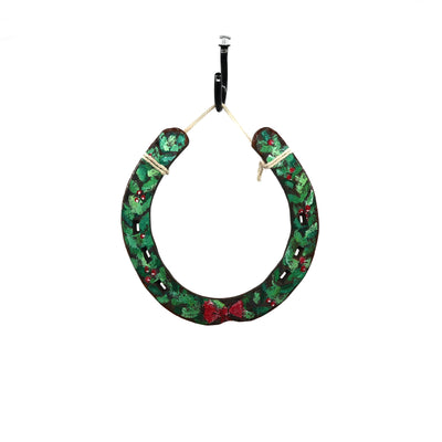 Wild Sour Hand Painted holiday horseshoe with green festive design and red bow hanging for rustic home decor