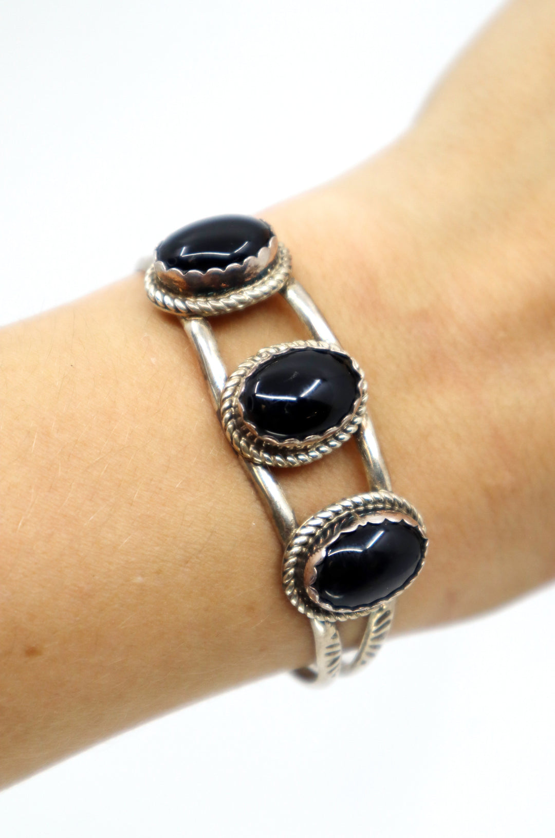 Handmade Navajo sterling silver cuff bracelet with three oval onyx stones