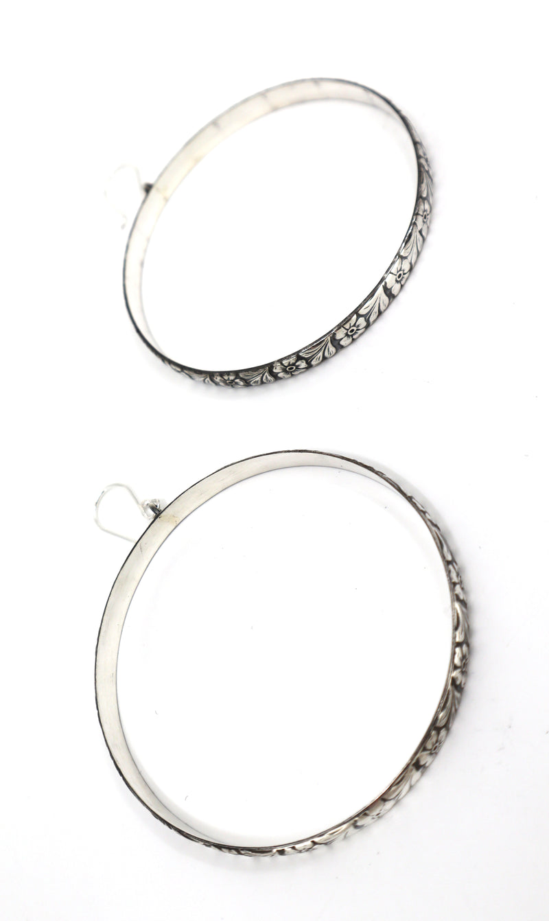 Handmade sterling silver floral detail hoop earrings with intricate design and 2.5-inch diameter