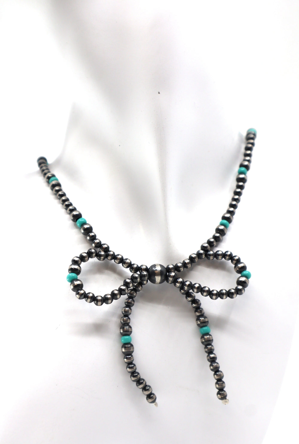 Handmade sterling silver necklace with pearl turquoise bow design