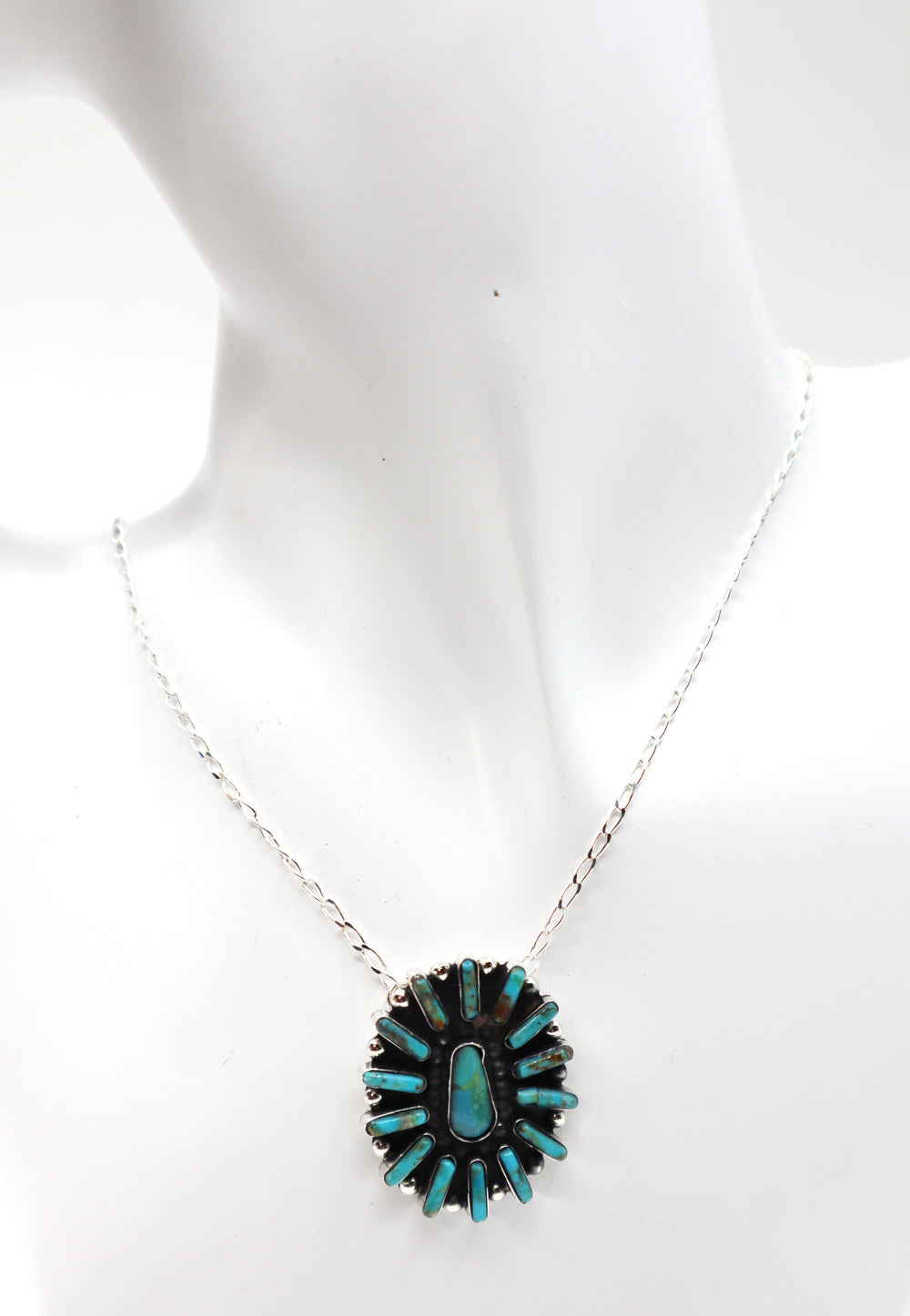 Handmade sterling silver turquoise concho necklace on display bust
