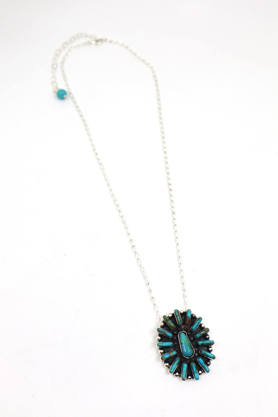 Handmade sterling silver necklace with turquoise concho pendant