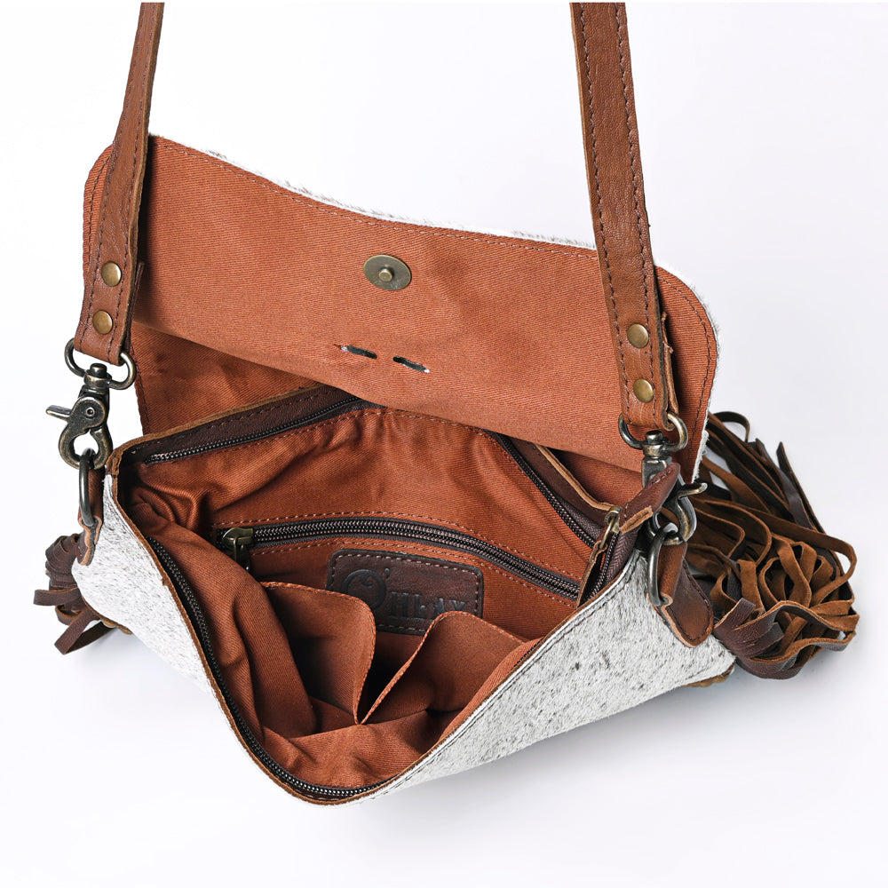 Open Ohlay Crossbody Bag showing brown interior and zipper compartments with leather strap and fringes