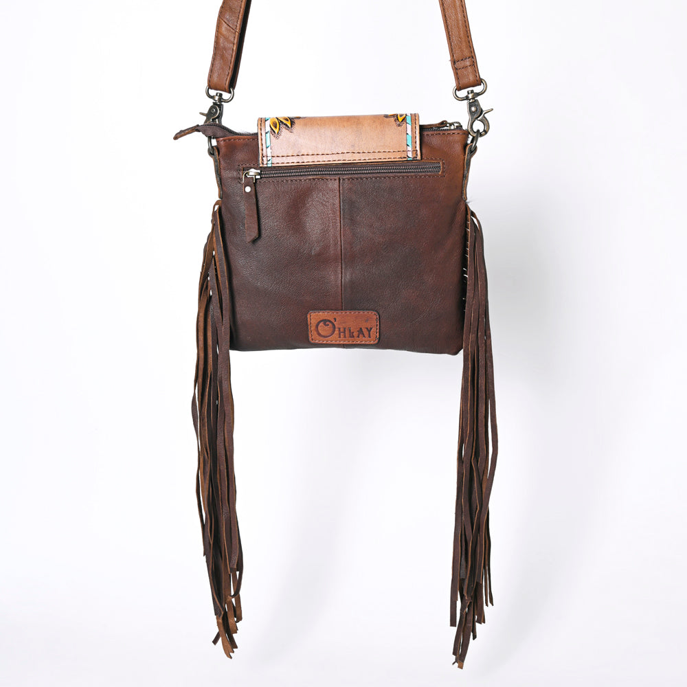 Ohlay Crossbody Bag KBG313 in genuine cowhide leather with fringe design, adjustable strap, and durable zipper closure.
