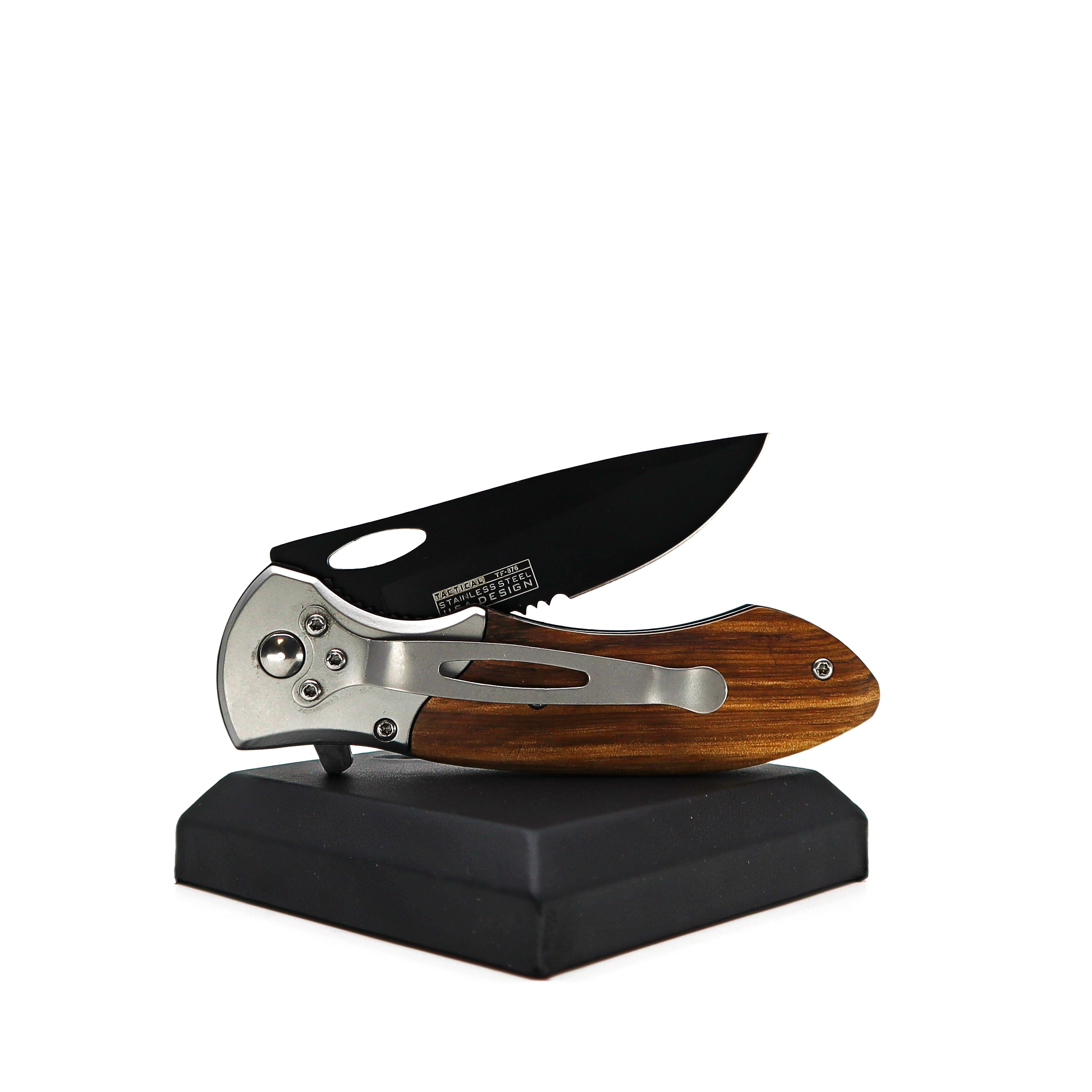 Tac Force Tactical folding knife with black 440 stainless steel blade and wooden pakkawood handle on display stand