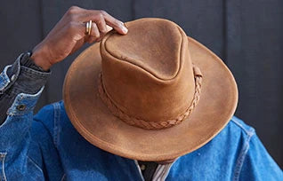 Minnetonka Fold Up Hat made of premium leather with braided hatband, perfect for outdoor adventures.