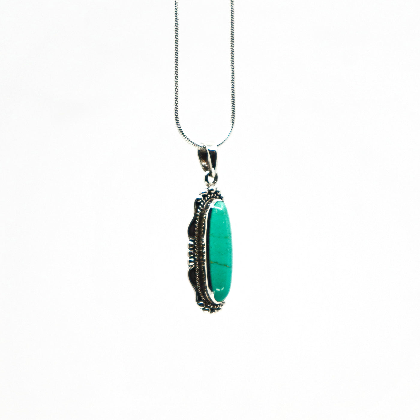 Sterling silver turquoise necklace with an elongated oval turquoise pendant on a delicate silver chain