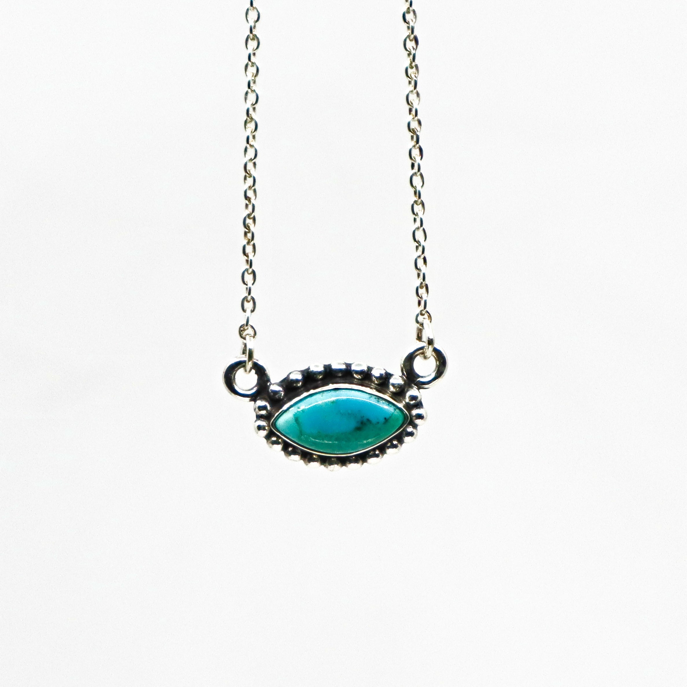 Handmade sterling silver necklace with turquoise oval pendant on a delicate chain