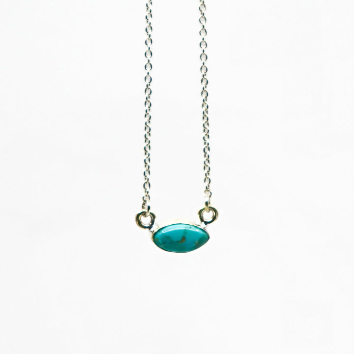Handmade sterling silver necklace with oval turquoise pendant on delicate chain