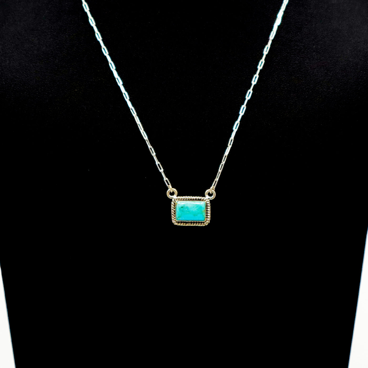Handmade woven border sterling silver necklace with small turquoise bar pendant