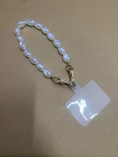 Glitter pearl phone lanyard with anti-lost patch and keychain, designed for universal phone case fit and hands-free convenience.