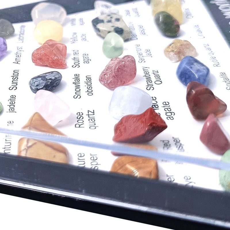 36-piece healing crystal gemstone chakra set with multicolor stones in triangular display case.