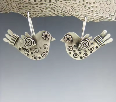 Vintage charm geometric hollow bird dangle earrings with silver-tone finish.