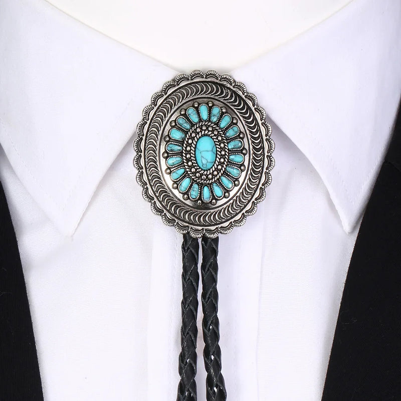 Cowboys carved turquoise flower bolo tie with genuine leather cord and silver detailing