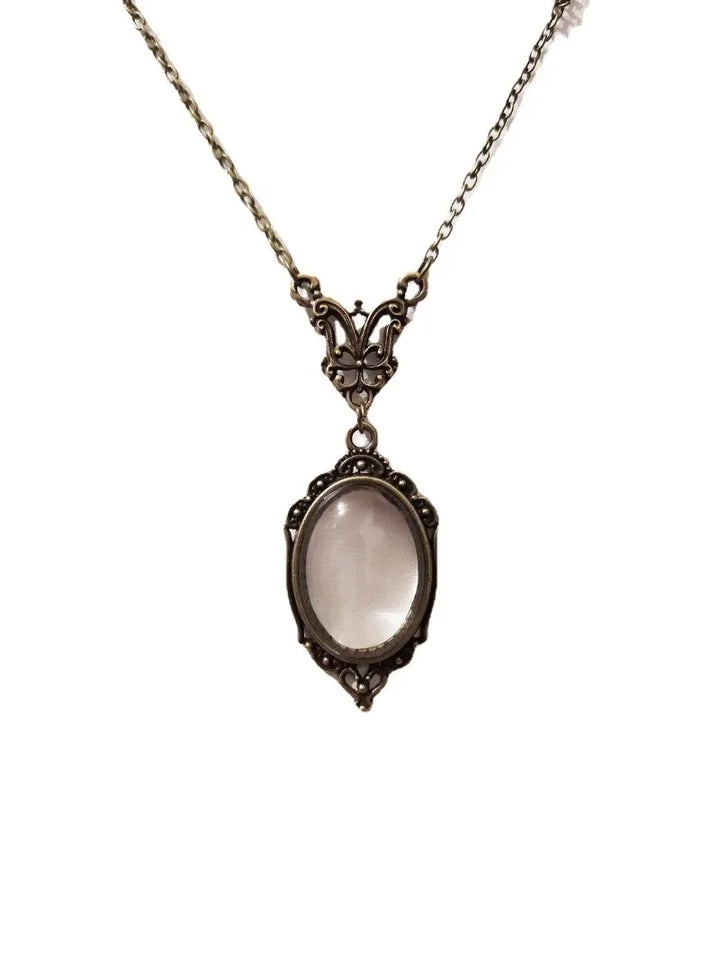 Gothic vintage magnifying glass pendant necklace with steampunk Victorian design.