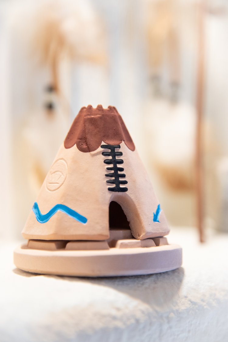 Handcrafted teepee incense burner with traditional design and piñon incense bricks, creating a calming Southwestern aroma.