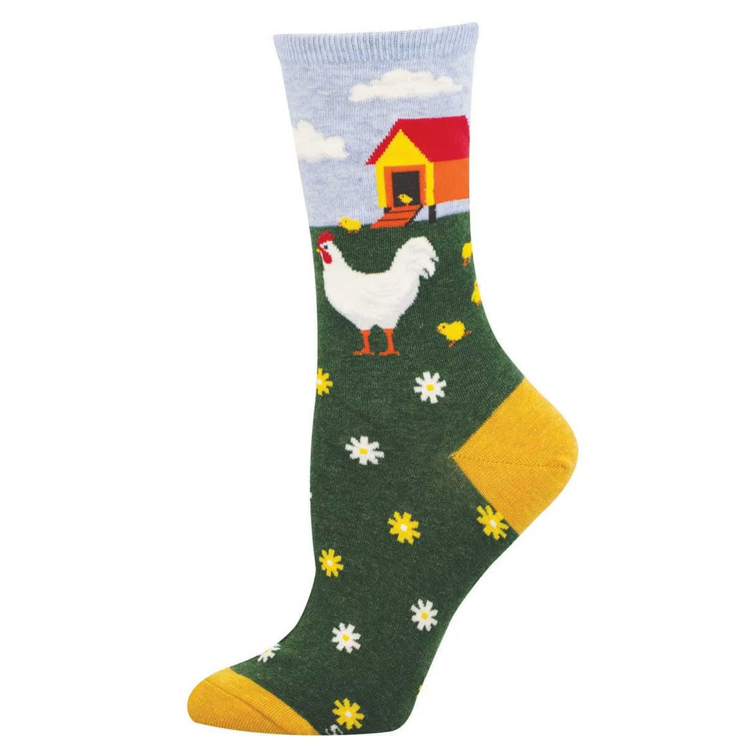 Crew length Mother Hen socks with hen and chick design, green background with flowers, yellow heel and toe.