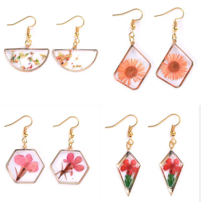 Transparent dried flower resin pendant earrings with geometric shapes and gold hooks