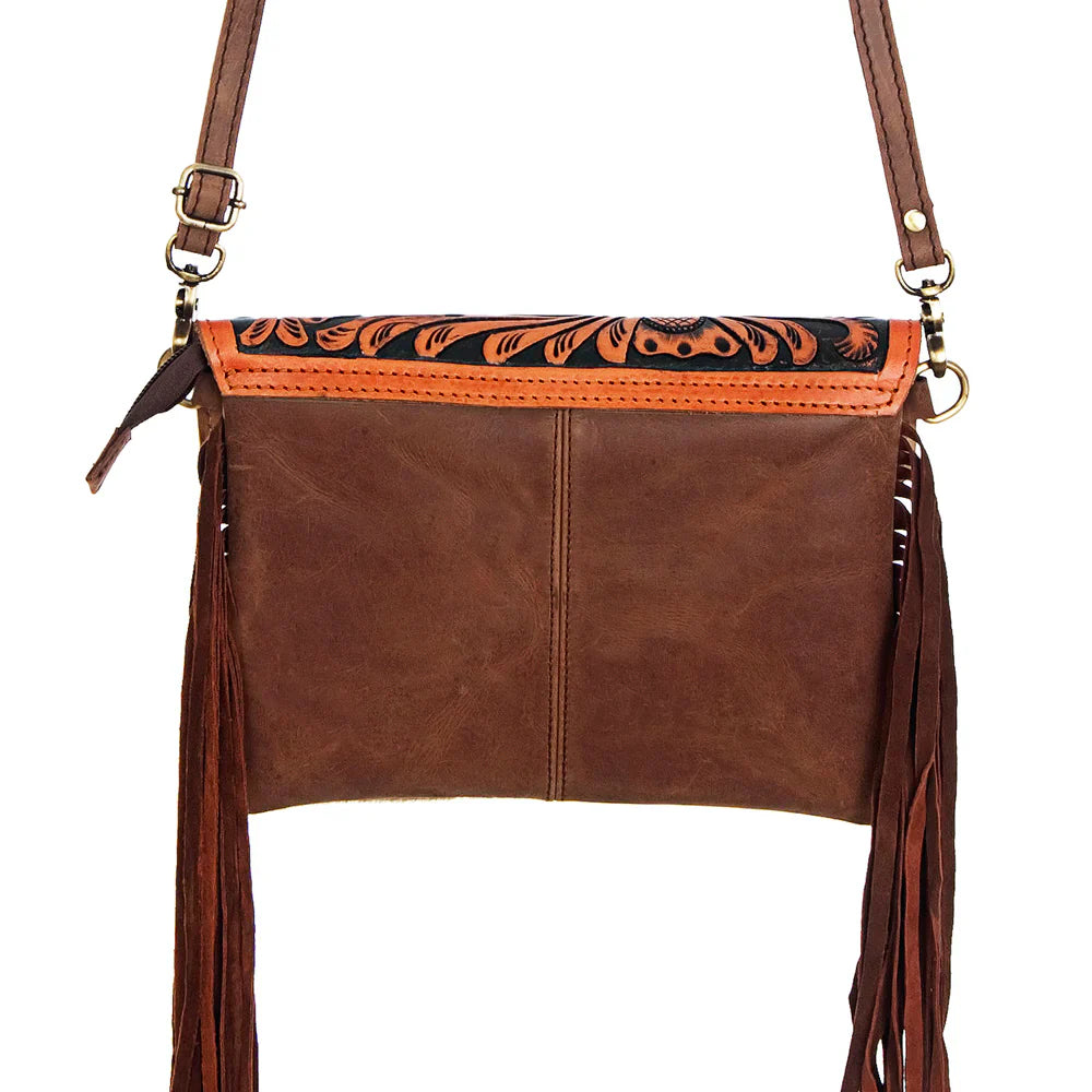 American Darling Small Crossbody Messenger Bag in full grain leather with cowhide hair, fringe details, and turquoise stone accent.